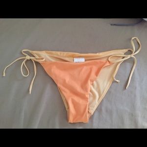 Light and dark orange bikini bottoms, side ties